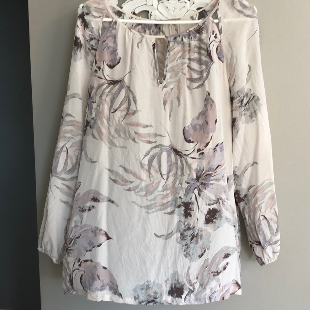 Shear cream and floral blouse